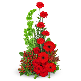 Red roses, carnations, and gerbera daisies in a tall arrangement