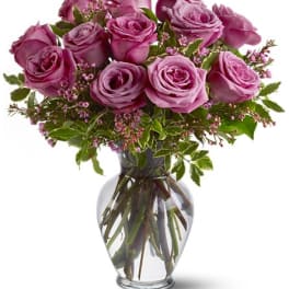 Pink rose bouquet in a clear glass vase