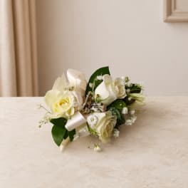 White rose bridal bouquet with satin ribbon and baby's breath