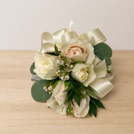 Cream rose bridal bouquet with ribbon and greenery