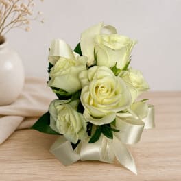White rose bouquet with ivory ribbon bows