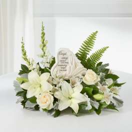 White floral sympathy arrangement with a memorial stone centerpiece