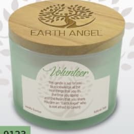 A mint-green candle in a glass jar with a wooden lid