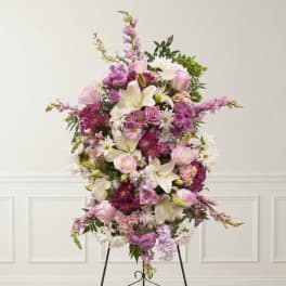 Pink and white floral standing spray on an easel