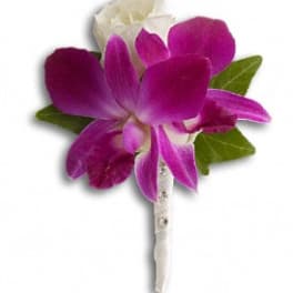 Purple orchid boutonniere with white accent petals and green leaves