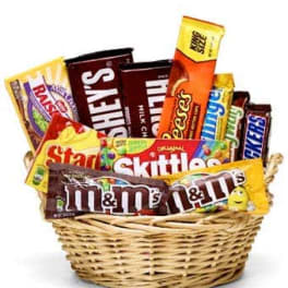 Basket filled with assorted candy bars and sweets