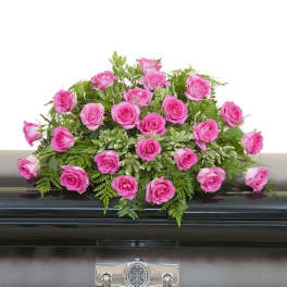 Pink rose arrangement on a casket
