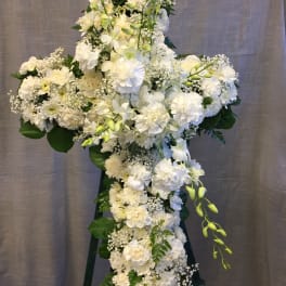 Large white floral standing spray on an easel