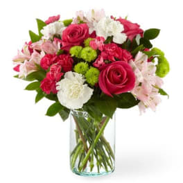 Mixed pink and white bouquet in a clear glass vase