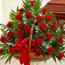 Basket of red roses with a red bow