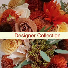 Bouquet of orange, cream, and blush flowers with greenery
