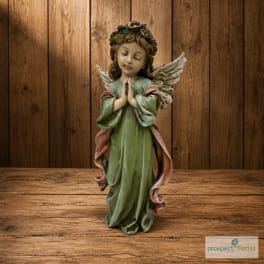 Decorative angel figurine in a green robe with folded hands