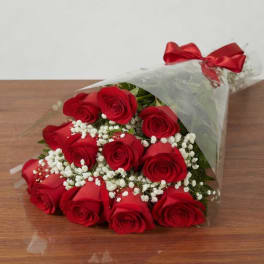 Bouquet of red roses with white baby's breath in clear wrap