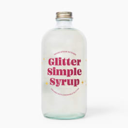 Bottle of glitter simple syrup with pink label