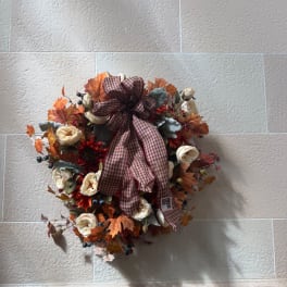 Autumn floral wreath with cream roses and a plaid ribbon bow