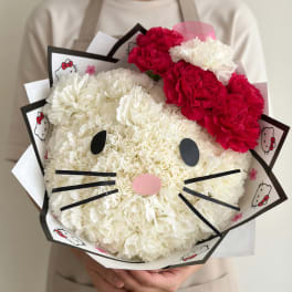 Hello Kitty-shaped bouquet of white and red carnations with printed wrapping