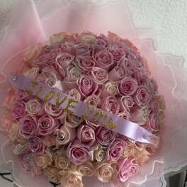 Pink rose bouquet with a lavender ribbon reading "I LOVE YOU"