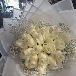 Cream rose bouquet with a silver tiara and white wrapping