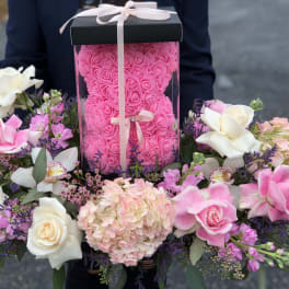 Pink rose box arrangement with white and blush flowers around it