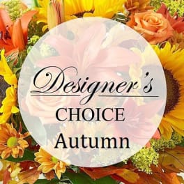 Autumn flower arrangement with sunflowers, roses, and orange lilies