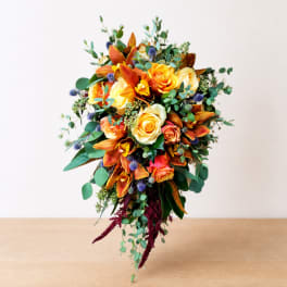 Wedding bouquet with orange lilies and yellow roses