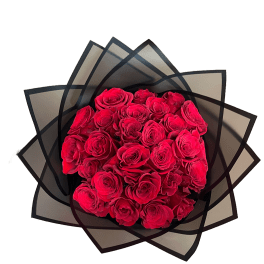 Bouquet of red roses wrapped in black paper