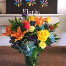 Colorful mixed bouquet in a clear glass vase