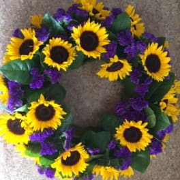 Sunflower wreath with purple filler flowers