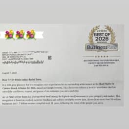 Printed award letter with a floral logo and BusinessRate badge