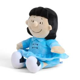 Plush doll in a blue dress sitting on a white background