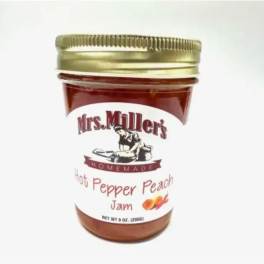 Jar of Mrs. Miller's hot pepper peach jam with a gold lid