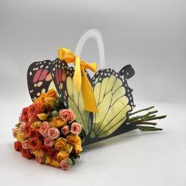 Bouquet of multicolored roses in a butterfly-shaped gift basket