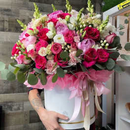 Large pink and white rose bouquet in a white hat box