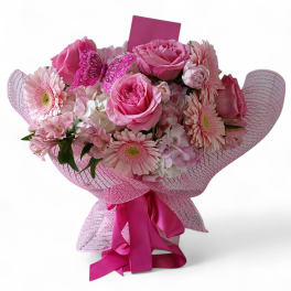Pink rose and gerbera bouquet with a butterfly decoration and ribbon wrap