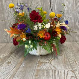 Mixed autumn bouquet in a white pumpkin-shaped container