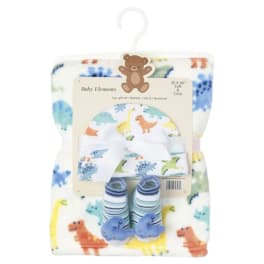 Baby gift set with a dinosaur blanket, hat, bib, and booties