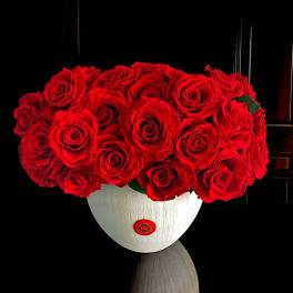 Red rose bouquet in a white vase
