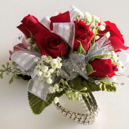 Bouquet of red roses with white filler flowers and silver ribbon