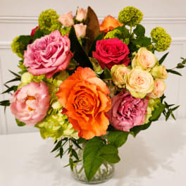Colorful rose bouquet in a clear glass vase