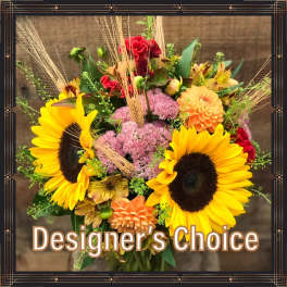 Mixed bouquet with sunflowers, dahlias, and pink filler flowers