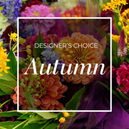 Autumn-themed bouquet with orange, pink, and yellow flowers