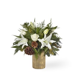 White lilies and roses in a wooden vase with pinecones