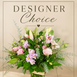 Pink and white mixed flower arrangement in a glass vase