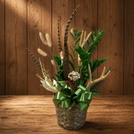 Decorative plant arrangement in a woven basket with a green ribbon