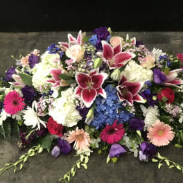 Large mixed floral spray with lilies, roses, hydrangeas, and gerbera daisies