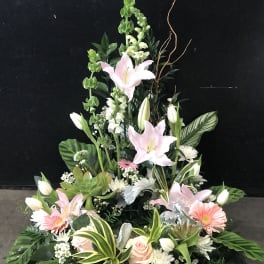 Tall floral spray with pink lilies, white blooms, and greenery