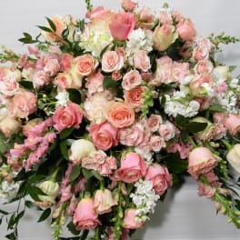 Large bouquet of pink and white roses with mixed blooms