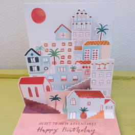 Pop-up birthday card with colorful houses and palm trees