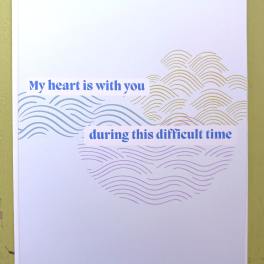 Sympathy greeting card with blue text and abstract wave patterns in soft colors