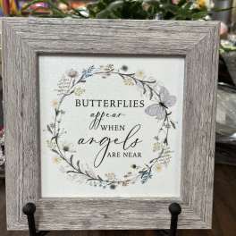 Framed sign with butterflies and the words "butterflies appear when angels are near"